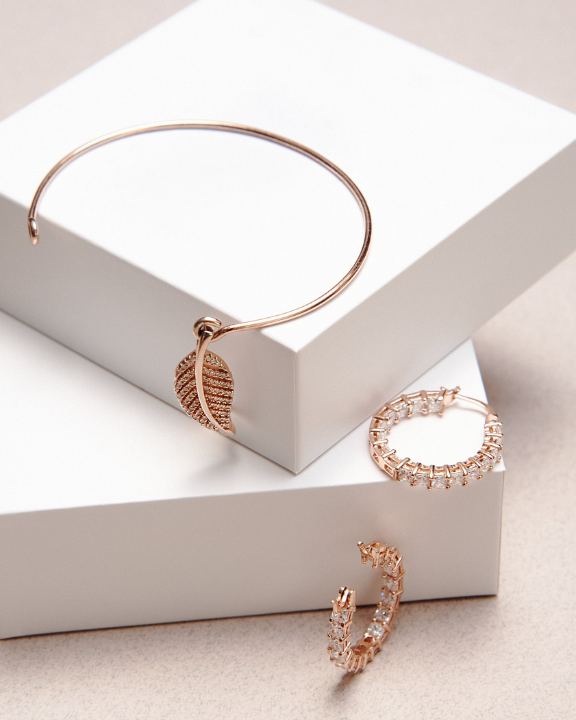 Gold and Silver Bracelet on White Box